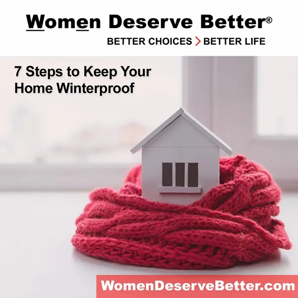 A model house surrounded by a red scarf